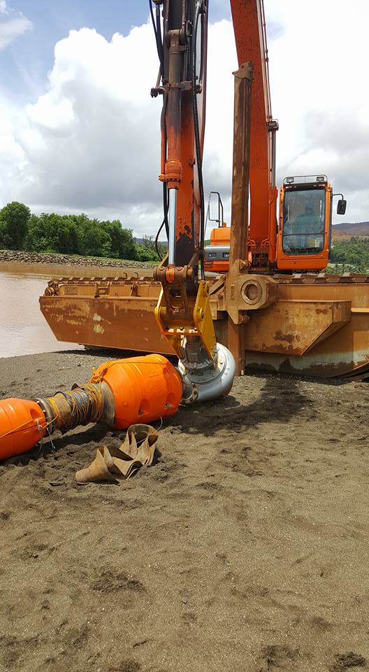 Dredging to remove silt and sediments from water for environmental protection