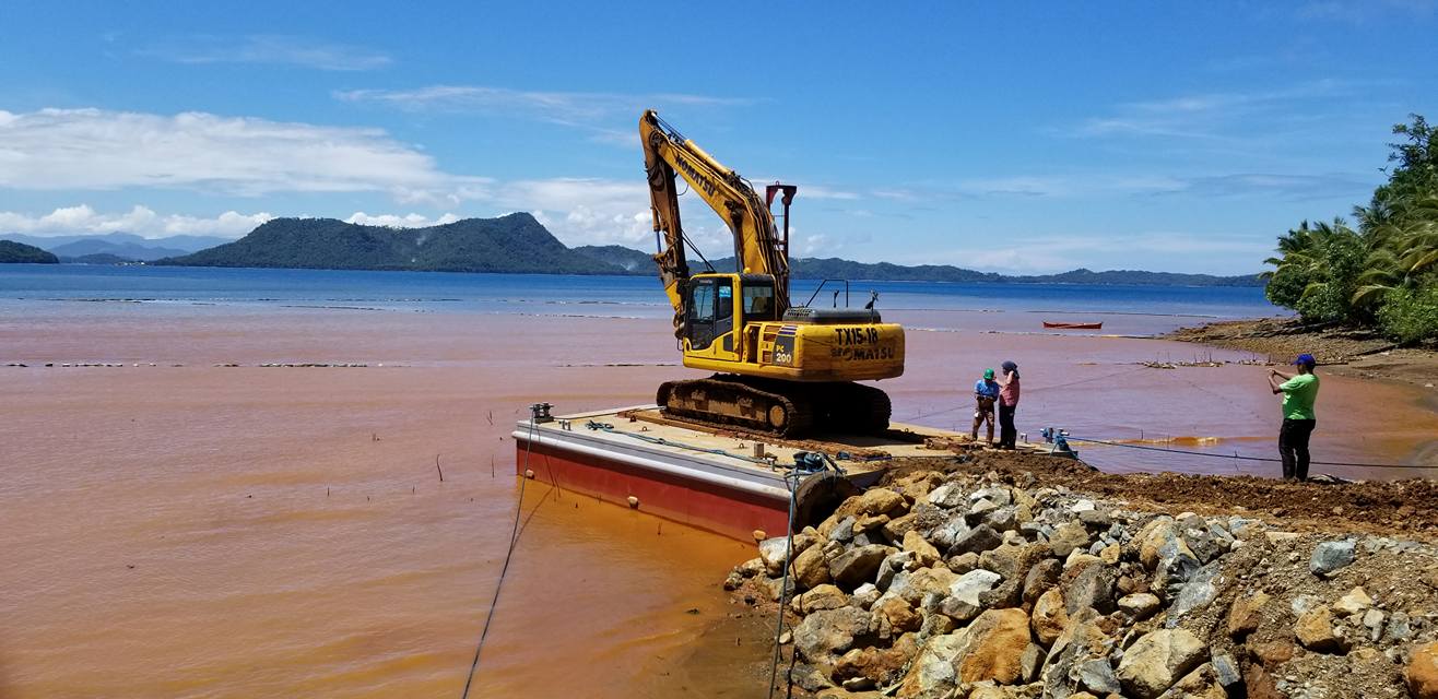 Dredging to remove silt and sediments from water for environmental protection