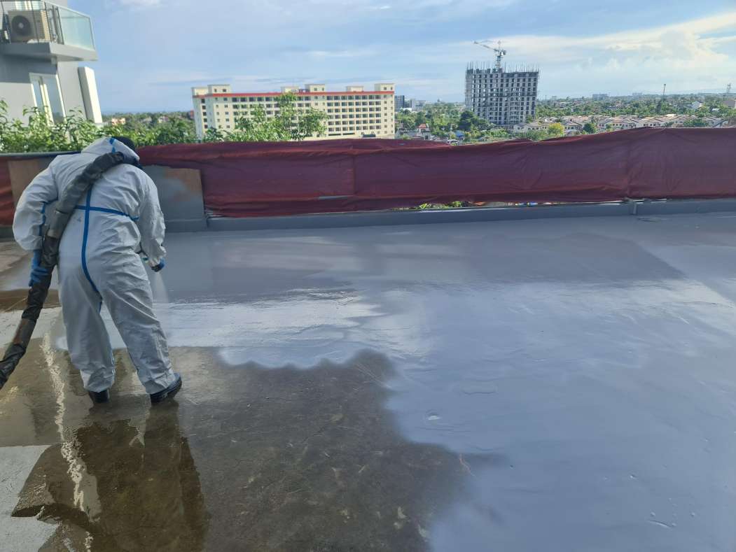 Applying polyurea advanced waterproofing on a roofdeck to prevent water leaks