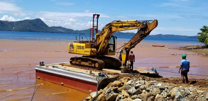 Dredging to remove silt and sediments from water for environmental protection